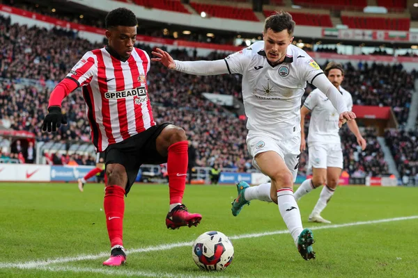 stock image Amad Diallo #16 of Sunderland battles Liam Cullen #20 of Swansea City during the Sky Bet Championship match Sunderland vs Swansea City at Stadium Of Light, Sunderland, United Kingdom, 14th January 202