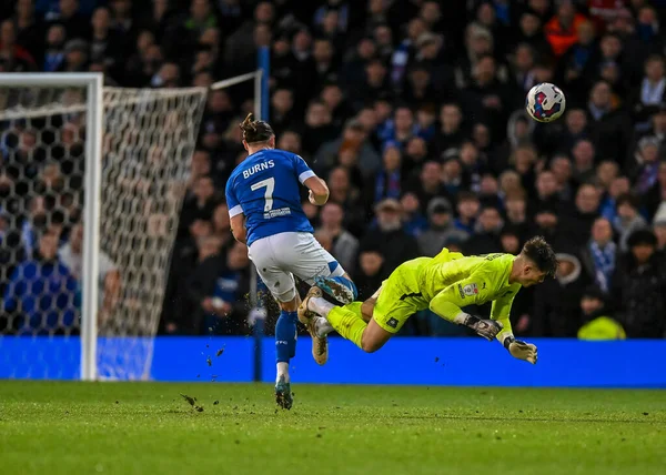 Plymouth Argyle goalkeeper Michael Cooper  (1) makes a brave head clearance out of the big box with his head while under pressure from Ipswich Town forward Wes Burns  (7) during the Sky Bet League 1 match Ipswich Town vs Plymouth Argyle at Portman Ro
