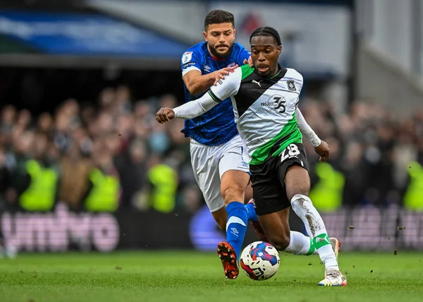 Plymouth Argyle midfielder Jay Matete (28)  goes past Ipswich Town midfielder Sam Morsy  (5)  during the Sky Bet League 1 match Ipswich Town vs Plymouth Argyle at Portman Road, Ipswich, United Kingdom, 14th January 202