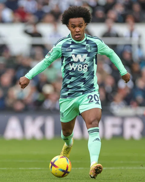 Willian #20 of Fulham runs with the ball during the Premier League match Newcastle United vs Fulham at St. James's Park, Newcastle, United Kingdom, 15th January 202