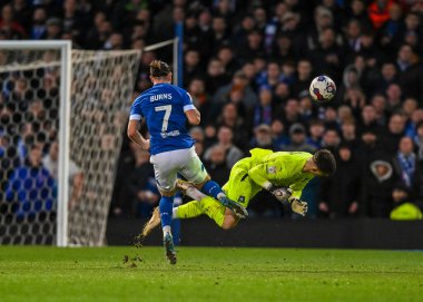 Plymouth Argyle goalkeeper Michael Cooper  (1) makes a brave head clearance out of the big box with his head while under pressure from Ipswich Town forward Wes Burns  (7)  during the Sky Bet League 1 match Ipswich Town vs Plymouth Argyle at Portman R