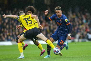 Morgan Rogers #25 of Blackpool draws a foul from Craig Cathcart #15 of Watford during the Sky Bet Championship match Watford vs Blackpool at Vicarage Road, Watford, United Kingdom, 14th January 202