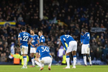 Dejected Everton players on the pitch whilst Everton fans protest after the Premier League match Everton vs Southampton at Goodison Park, Liverpool, United Kingdom, 14th January 2023