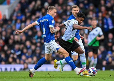 Plymouth Argyle forward Niall Ennis  (11) goes past Ipswich Town defender Luke Woolfenden  (6)  during the Sky Bet League 1 match Ipswich Town vs Plymouth Argyle at Portman Road, Ipswich, United Kingdom, 14th January 202
