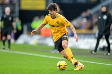 Hugo Bueno #64 of Wolverhampton Wanderers with the ball during the Premier League match Wolverhampton Wanderers vs West Ham United at Molineux, Wolverhampton, United Kingdom, 14th January 202