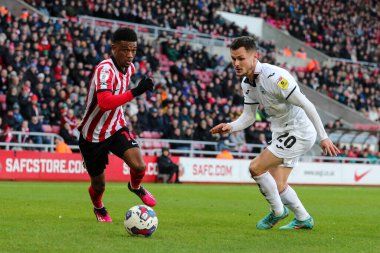 Amad Diallo #16 of Sunderland battles Liam Cullen #20 of Swansea City during the Sky Bet Championship match Sunderland vs Swansea City at Stadium Of Light, Sunderland, United Kingdom, 14th January 202