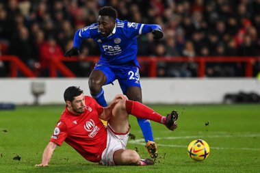 Wilfred Ndidi #25 of Leicester City is tackled by Scott McKenna #26 of Nottingham Forest during the Premier League match Nottingham Forest vs Leicester City at City Ground, Nottingham, United Kingdom, 14th January 202