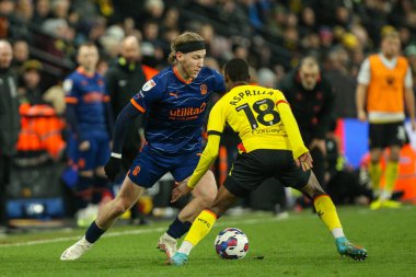 Josh Bowler #11 of Blackpool runs at Yaser Asprilla #18 of Watford during the Sky Bet Championship match Watford vs Blackpool at Vicarage Road, Watford, United Kingdom, 14th January 202