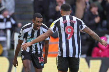 Alexander Isak #14 of Newcastle United celebrates his goal to make it 1-0 with Callum Wilson #9 of Newcastle United during the Premier League match Newcastle United vs Fulham at St. James's Park, Newcastle, United Kingdom, 15th January 202