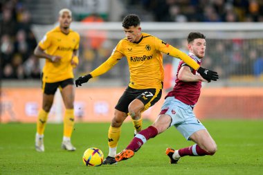 Matheus Nunes #27 of Wolverhampton Wanderers challenges Declan Rice #41 of West Ham United during the Premier League match Wolverhampton Wanderers vs West Ham United at Molineux, Wolverhampton, United Kingdom, 14th January 202