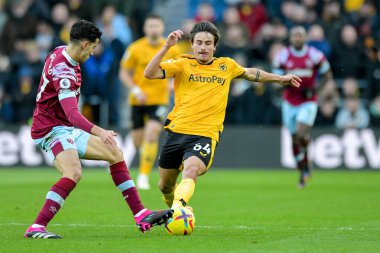 Nayef Aguerd #27 of West Ham United challenges for the ball with Hugo Bueno #64 of Wolverhampton Wanderers during the Premier League match Wolverhampton Wanderers vs West Ham United at Molineux, Wolverhampton, United Kingdom, 14th January 202