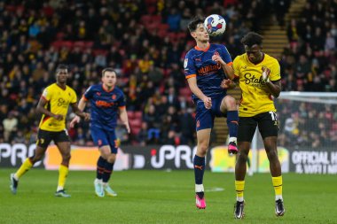 Charlie Patino #28 of Blackpool and Ismael Kone #11 of Watford challenge for a header during the Sky Bet Championship match Watford vs Blackpool at Vicarage Road, Watford, United Kingdom, 14th January 202