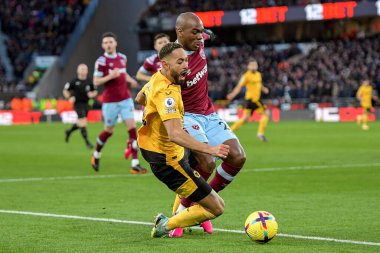 Matheus Cunha #12 of Wolverhampton Wanderers goes down under a challenge from Angelo Ogbonna #21 of West Ham United during the Premier League match Wolverhampton Wanderers vs West Ham United at Molineux, Wolverhampton, United Kingdom, 14th January 20