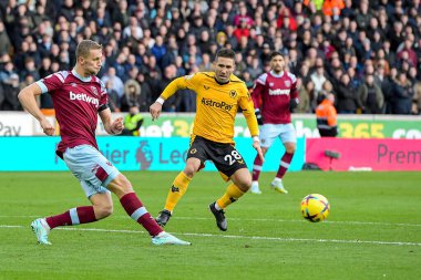 Tomas Soucek #28 of West Ham United clears the ball in front Joao Moutinho #28 of Wolverhampton Wanderers during the Premier League match Wolverhampton Wanderers vs West Ham United at Molineux, Wolverhampton, United Kingdom, 14th January 202