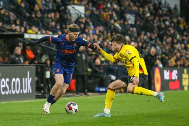 Josh Bowler #11 of Blackpool runs at James Morris #42 of Watford during the Sky Bet Championship match Watford vs Blackpool at Vicarage Road, Watford, United Kingdom, 14th January 202
