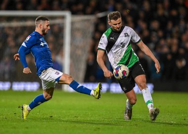 Plymouth Argyle defender Macaulay Gillesphey  (3) clears the ball while under pressure from Ipswich Town forward Conor Chaplin  (10)  during the Sky Bet League 1 match Ipswich Town vs Plymouth Argyle at Portman Road, Ipswich, United Kingdom, 14th Jan