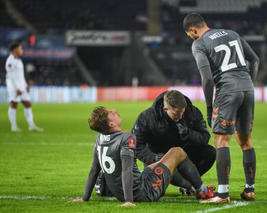 Cameron Pring #16 of Bristol City  receives treatment during the Emirates FA Cup Third Round Replay match Swansea City vs Bristol City at Swansea.com Stadium, Swansea, United Kingdom, 17th January 202