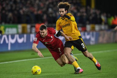 James Milner #7 of Liverpool is fouled by Rayan At-Nouri #3 of Wolverhampton Wanderers during the Emirates FA Cup Third Round Replay match Wolverhampton Wanderers vs Liverpool at Molineux, Wolverhampton, United Kingdom, 17th January 2023