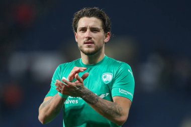 Darren Oldaker #26 of Chesterfield applauds the travelling fans after the Emirates FA Cup Third Round Replay match West Bromwich Albion vs Chesterfield at The Hawthorns, West Bromwich, United Kingdom, 17th January 202