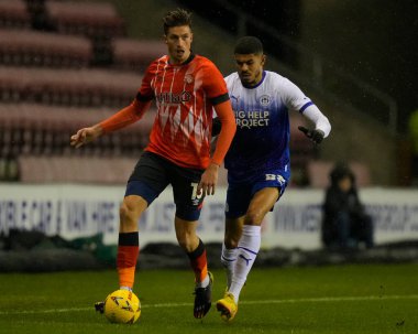 Reece Burke #16 of Luton Town under pressure from Ashley Fletcher #23 of Wigan Athletic during the Emirates FA Cup match Third Round Replay Wigan Athletic vs Luton Town at DW Stadium, Wigan, United Kingdom, 17th January 202