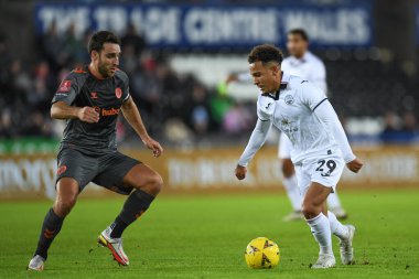 Matthew Sorinola #29 of Swansea City Under pressure from Matthew James #6 of Bristol City during the Emirates FA Cup Third Round Replay match Swansea City vs Bristol City at Swansea.com Stadium, Swansea, United Kingdom, 17th January 202