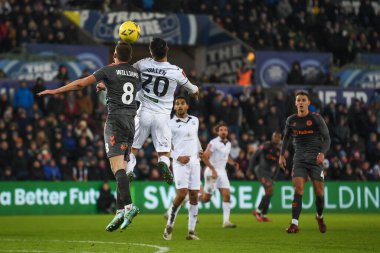 Liam Cullen #20 of Swansea City and Joe Williams #8 of Bristol City compete the high ball during the Emirates FA Cup Third Round Replay match Swansea City vs Bristol City at Swansea.com Stadium, Swansea, United Kingdom, 17th January 202