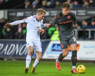 Cameron Pring #16 of Bristol City takes on Ollie Cooper #31 of Swansea City during the Emirates FA Cup Third Round Replay match Swansea City vs Bristol City at Swansea.com Stadium, Swansea, United Kingdom, 17th January 202