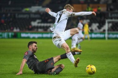 Joe Williams #8 of Bristol City tackles Ollie Cooper #31 of Swansea City during the Emirates FA Cup Third Round Replay match Swansea City vs Bristol City at Swansea.com Stadium, Swansea, United Kingdom, 17th January 202