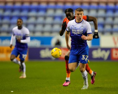 Charlie Hughes #32 of Wigan Athletic makes a break during the Emirates FA Cup match Third Round Replay Wigan Athletic vs Luton Town at DW Stadium, Wigan, United Kingdom, 17th January 202