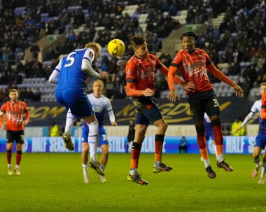 Jack Whatmough #5 of Wigan Athletic heads against Reece Burke #16 of Luton Town during the Emirates FA Cup match Third Round Replay Wigan Athletic vs Luton Town at DW Stadium, Wigan, United Kingdom, 17th January 202