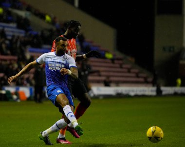 Elijah Adebayo #11 of Luton Town competes for the ball with Curtis Tilt #16 of Wigan Athletic  during the Emirates FA Cup match Third Round Replay Wigan Athletic vs Luton Town at DW Stadium, Wigan, United Kingdom, 17th January 202