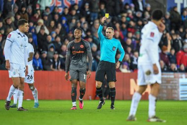 Nathan Wood #23 of Swansea City  receives yellow card from referee , Graham Scott, during the Emirates FA Cup Third Round Replay match Swansea City vs Bristol City at Swansea.com Stadium, Swansea, United Kingdom, 17th January 202