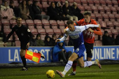 Reece Burke #16 of Luton Town competes for the ball with Tom Naylor #4 of Wigan Athletic during the Emirates FA Cup match Third Round Replay Wigan Athletic vs Luton Town at DW Stadium, Wigan, United Kingdom, 17th January 202