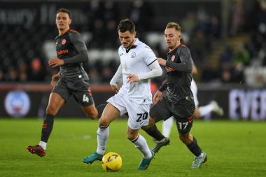Liam Cullen #20 of Swansea City Under pressure from Mark Sykes #17 of Bristol City during the Emirates FA Cup Third Round Replay match Swansea City vs Bristol City at Swansea.com Stadium, Swansea, United Kingdom, 17th January 202