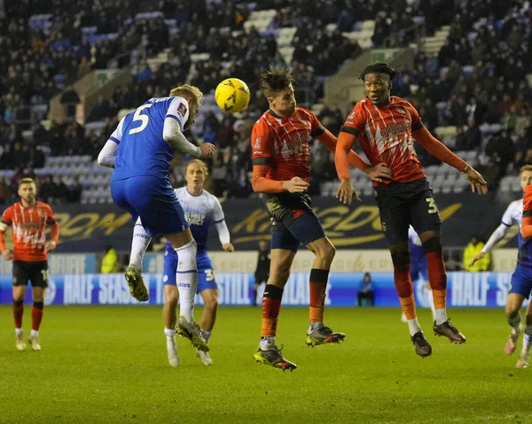 Jack Whatmough #5 of Wigan Athletic heads against Reece Burke #16 of Luton Town during the Emirates FA Cup match Third Round Replay Wigan Athletic vs Luton Town at DW Stadium, Wigan, United Kingdom, 17th January 202