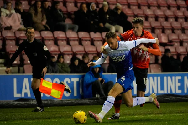Reece Burke #16 of Luton Town competes for the ball with Tom Naylor #4 of Wigan Athletic during the Emirates FA Cup match Third Round Replay Wigan Athletic vs Luton Town at DW Stadium, Wigan, United Kingdom, 17th January 202