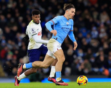 Jack Grealish #10 of Manchester City goes past Emerson Royal #12 of Tottenham Hotspur during the Premier League match Manchester City vs Tottenham Hotspur at Etihad Stadium, Manchester, United Kingdom, 19th January 202
