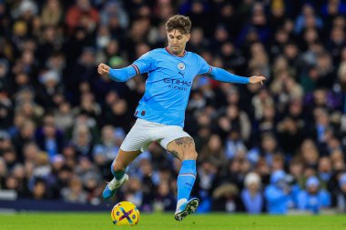 John Stones #5 of Manchester City in action during the Premier League match Manchester City vs Tottenham Hotspur at Etihad Stadium, Manchester, United Kingdom, 19th January 202