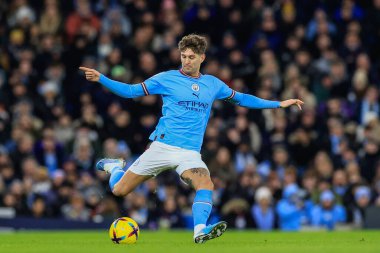 John Stones #5 of Manchester City in action during the Premier League match Manchester City vs Tottenham Hotspur at Etihad Stadium, Manchester, United Kingdom, 19th January 202
