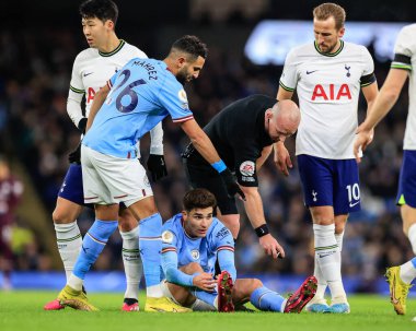 Riyad Mahrez #26 of Manchester City points to where the ball should sit with referee Simon Hooper during the Premier League match Manchester City vs Tottenham Hotspur at Etihad Stadium, Manchester, United Kingdom, 19th January 202