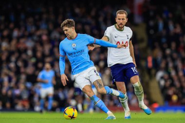 John Stones #5 of Manchester City holds tot Harry Kane #10 of Tottenham Hotspur during the Premier League match Manchester City vs Tottenham Hotspur at Etihad Stadium, Manchester, United Kingdom, 19th January 202