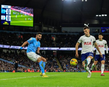Riyad Mahrez #26 of Manchester City crosses the ball as Ivan Perii #14 of Tottenham Hotspur tries to block during the Premier League match Manchester City vs Tottenham Hotspur at Etihad Stadium, Manchester, United Kingdom, 19th January 2023