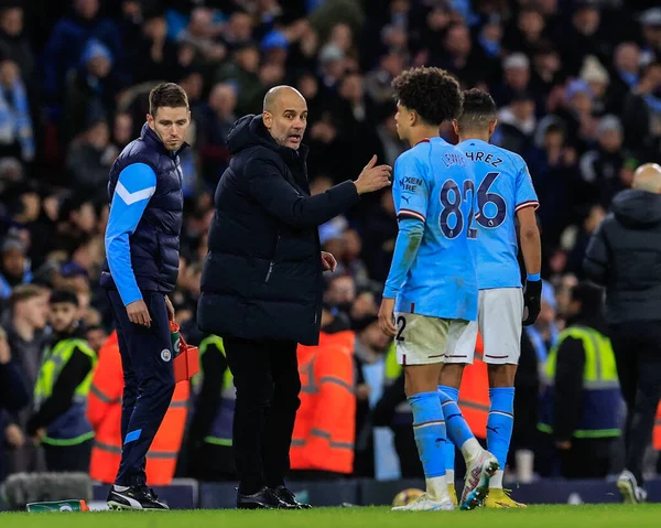 Pep Guardiola manager of Manchester City gives instruction to Rico Lewis #82 of Manchester City as play halts during the Premier League match Manchester City vs Tottenham Hotspur at Etihad Stadium, Manchester, United Kingdom, 19th January 202