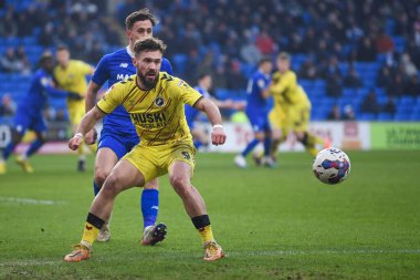 Tom Bradshaw #9 of Millwall under pressure from Ryan Wintle #6 of Cardiff City  during the Sky Bet Championship match Cardiff City vs Millwall at Cardiff City Stadium, Cardiff, United Kingdom, 21st January 202