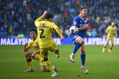 Dan McNamara #2 of Millwall clears his defence under pressure from Ryan Wintle #6 of Cardiff City  during the Sky Bet Championship match Cardiff City vs Millwall at Cardiff City Stadium, Cardiff, United Kingdom, 21st January 202