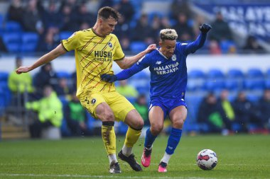 Callum Robinson #47 of Cardiff City under pressure from Jake Cooper #5 of Millwall during the Sky Bet Championship match Cardiff City vs Millwall at Cardiff City Stadium, Cardiff, United Kingdom, 21st January 202