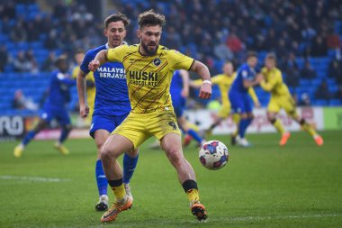 Tom Bradshaw #9 of Millwall under pressure from Ryan Wintle #6 of Cardiff City  during the Sky Bet Championship match Cardiff City vs Millwall at Cardiff City Stadium, Cardiff, United Kingdom, 21st January 202