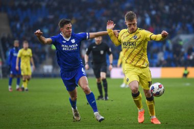 Zian Flemming #10 of Millwall under pressure from Ryan Wintle #6 of Cardiff City  during the Sky Bet Championship match Cardiff City vs Millwall at Cardiff City Stadium, Cardiff, United Kingdom, 21st January 202