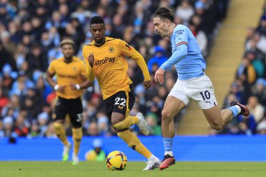 Jack Grealish #10 of Manchester City runs past Nelson Semedo #22 of Wolverhampton Wanderers during the Premier League match Manchester City vs Wolverhampton Wanderers at Etihad Stadium, Manchester, United Kingdom, 22nd January 202