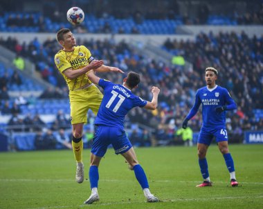 Shaun Hutchinson #4 of Millwall clears the ball under pressure from Callum O'Dowda #11 of Cardiff City  during the Sky Bet Championship match Cardiff City vs Millwall at Cardiff City Stadium, Cardiff, United Kingdom, 21st January 202